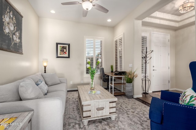 living room featuring a ceiling fan, baseboards, and recessed lighting