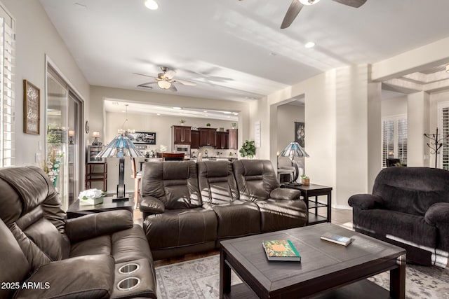 living room with a healthy amount of sunlight, a ceiling fan, and recessed lighting