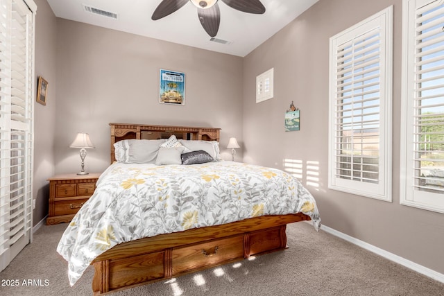 bedroom with carpet flooring, a ceiling fan, baseboards, and visible vents