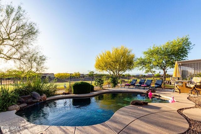 view of pool with a patio, fence, and a fenced in pool