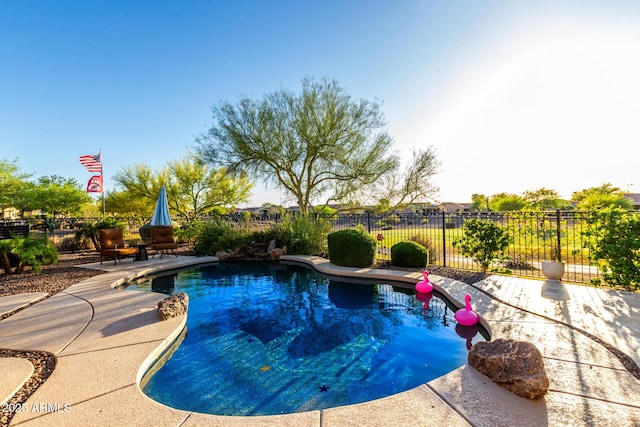view of pool featuring fence, a fenced in pool, and a patio