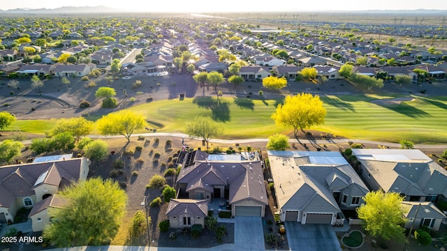drone / aerial view featuring a residential view, a mountain view, and golf course view