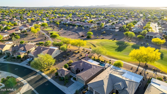 aerial view featuring a mountain view, golf course view, and a residential view