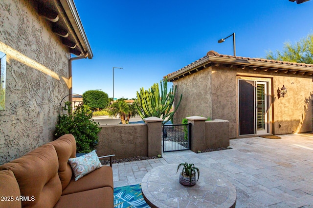 view of patio / terrace with a gate and fence