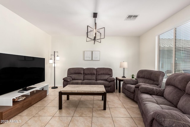 6746 W Wethersfield Rd, Peoria, AZ 85381 - living area with a chandelier, light tile patterned floors, and visible vents