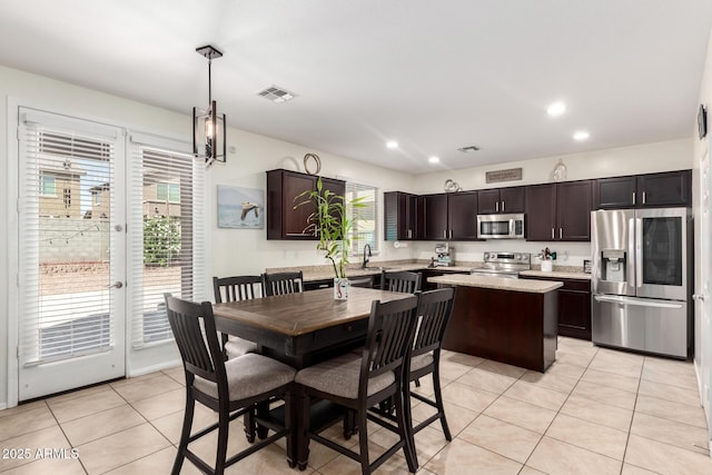 6746 W Wethersfield Rd, Peoria, AZ 85381 - dining space featuring recessed lighting, visible vents, and light tile patterned flooring