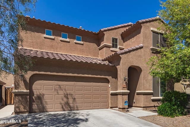 6746 W Wethersfield Rd, Peoria, AZ 85381 - mediterranean / spanish-style home with an attached garage, a tiled roof, driveway, and stucco siding