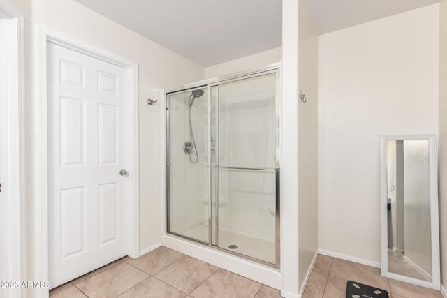 6746 W Wethersfield Rd, Peoria, AZ 85381 - full bathroom with a shower stall, baseboards, and tile patterned flooring