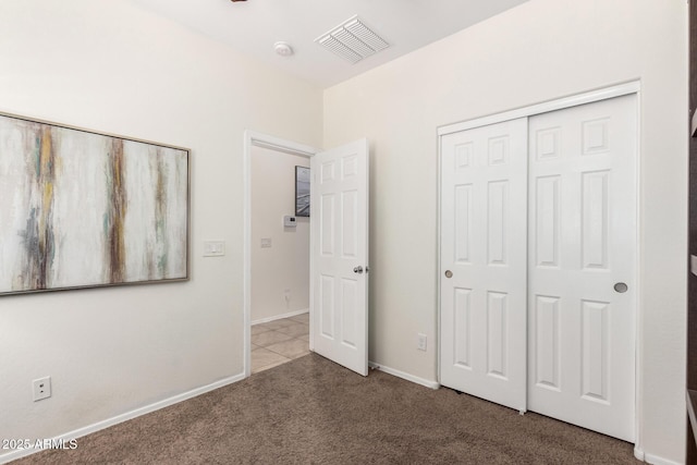 6746 W Wethersfield Rd, Peoria, AZ 85381 - unfurnished bedroom featuring carpet flooring, visible vents, a closet, and baseboards