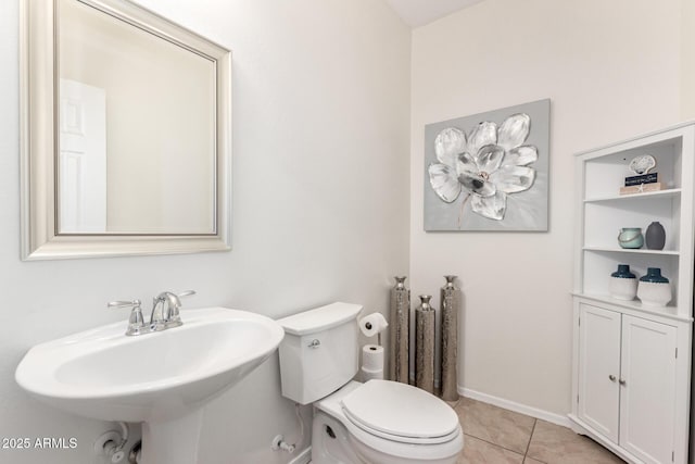 6746 W Wethersfield Rd, Peoria, AZ 85381 - half bathroom with a sink, toilet, tile patterned flooring, and baseboards