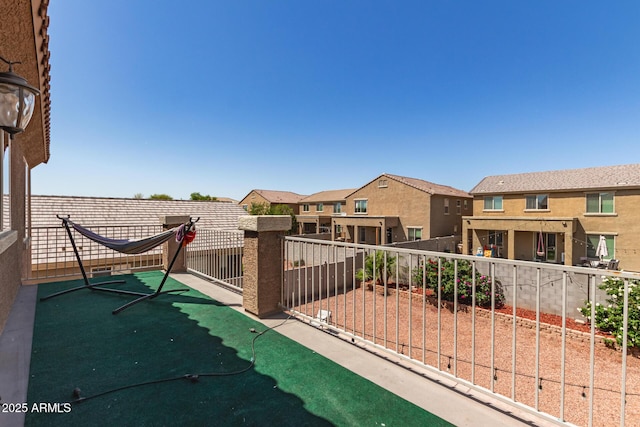 6746 W Wethersfield Rd, Peoria, AZ 85381 - view of patio featuring a residential view, a balcony, and fence