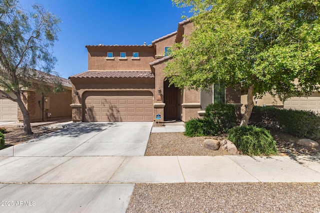 6746 W Wethersfield Rd, Peoria, AZ 85381 - view of front of property with a tiled roof, driveway, stucco siding, and a garage