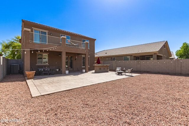6746 W Wethersfield Rd, Peoria, AZ 85381 - back of property with a patio, a fenced backyard, stucco siding, and a balcony