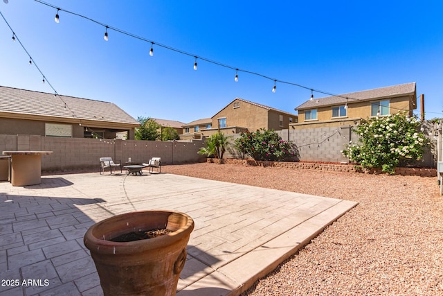 6746 W Wethersfield Rd, Peoria, AZ 85381 - view of patio featuring a fenced backyard and a fire pit