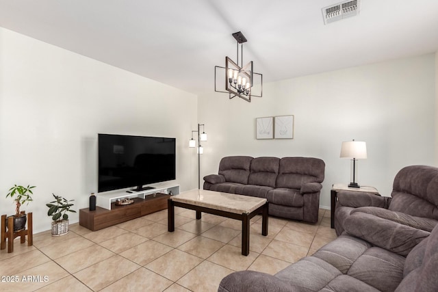 6746 W Wethersfield Rd, Peoria, AZ 85381 - living room with visible vents, a notable chandelier, light tile patterned flooring, and baseboards