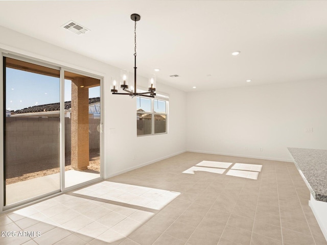 unfurnished dining area with light tile patterned floors and a notable chandelier