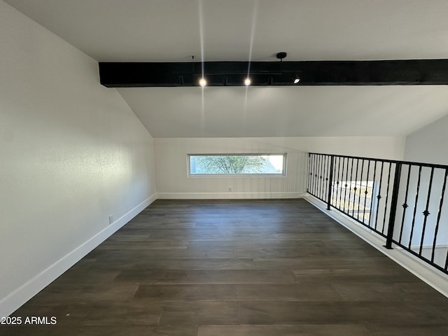 bonus room with lofted ceiling with beams and dark hardwood / wood-style flooring