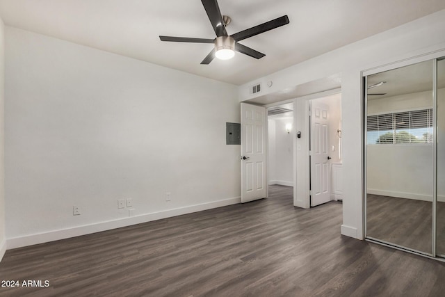 18202 Cave Creek Rd Unit 141, Phoenix, AZ 85032 - unfurnished bedroom featuring dark wood finished floors, baseboards, ceiling fan, and electric panel