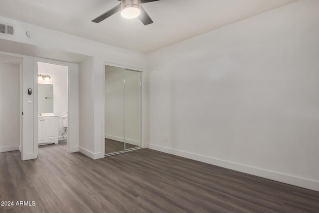 18202 Cave Creek Rd Unit 141, Phoenix, AZ 85032 - unfurnished bedroom with dark wood finished floors, baseboards, a closet, and a ceiling fan