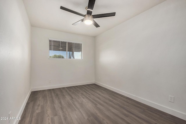 18202 Cave Creek Rd Unit 141, Phoenix, AZ 85032 - empty room featuring ceiling fan, baseboards, and dark wood-type flooring