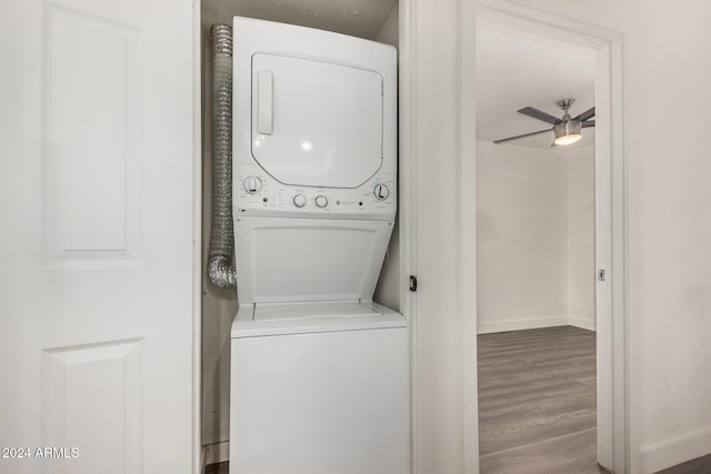 18202 Cave Creek Rd Unit 141, Phoenix, AZ 85032 - washroom featuring stacked washer and clothes dryer, wood finished floors, baseboards, and ceiling fan