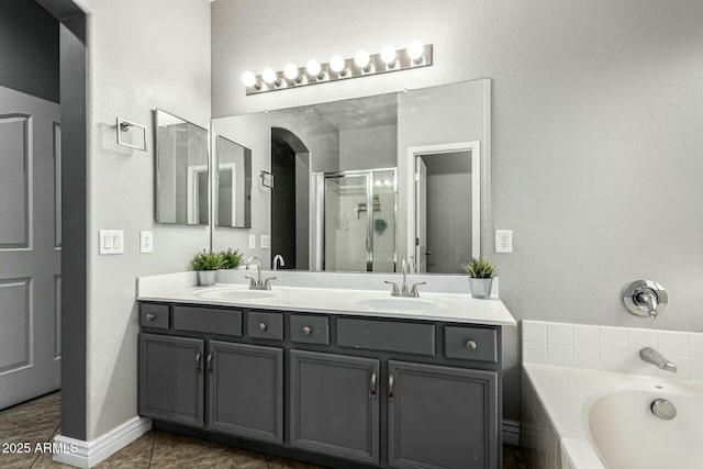 bathroom with vanity, shower with separate bathtub, and tile patterned flooring