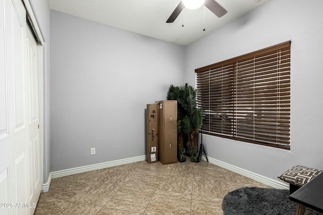 interior space featuring ceiling fan