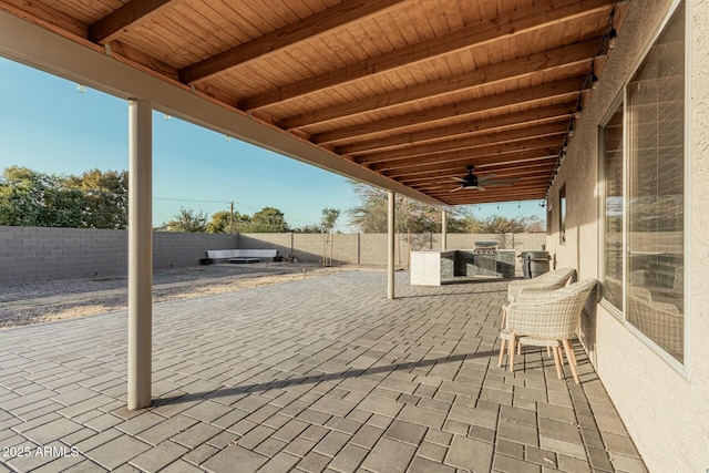 view of patio featuring exterior kitchen and ceiling fan