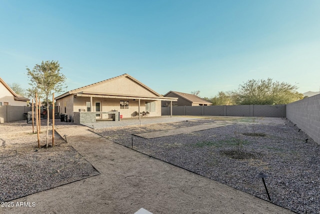 back of property with a patio area