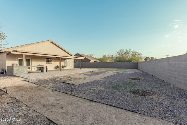 rear view of house featuring a patio