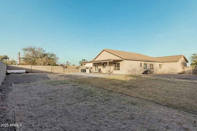 back of house featuring a patio