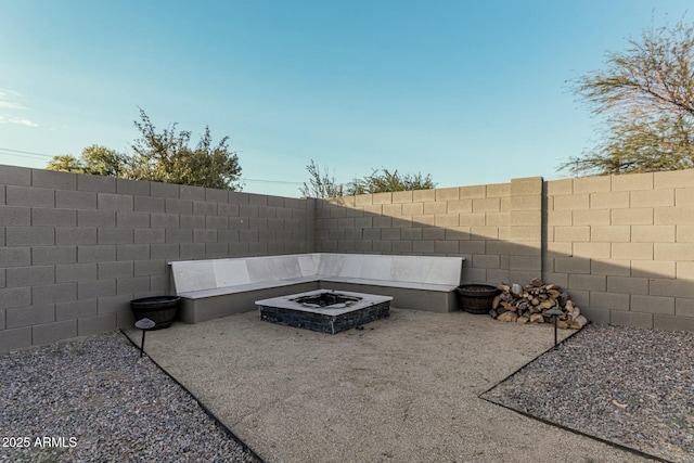 view of patio with an outdoor fire pit