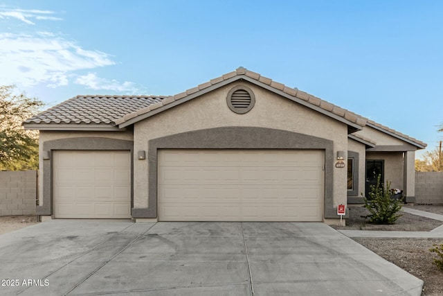 ranch-style home with a garage