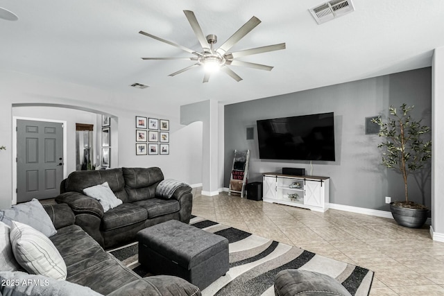 living room with ceiling fan and light tile patterned flooring