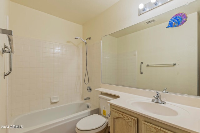 full bathroom with vanity, toilet, and tiled shower / bath