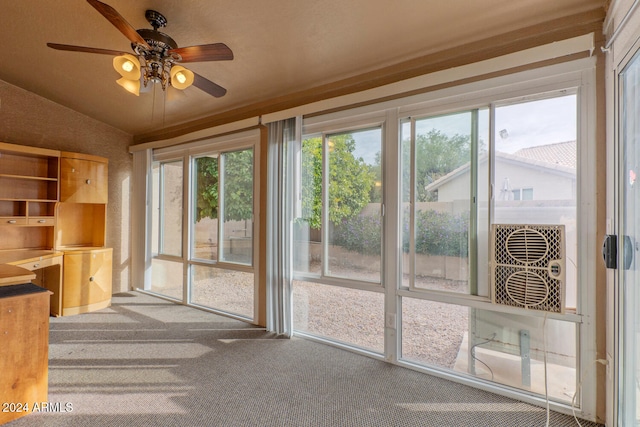 entryway featuring carpet, ceiling fan, and lofted ceiling