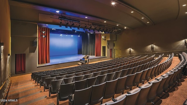 cinema room featuring carpet flooring