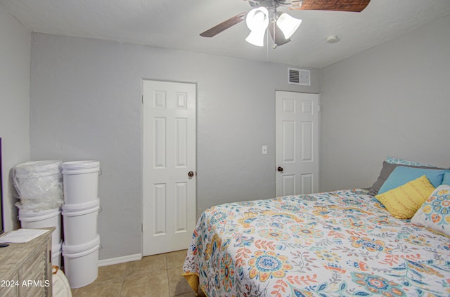 bedroom with light tile patterned floors and ceiling fan