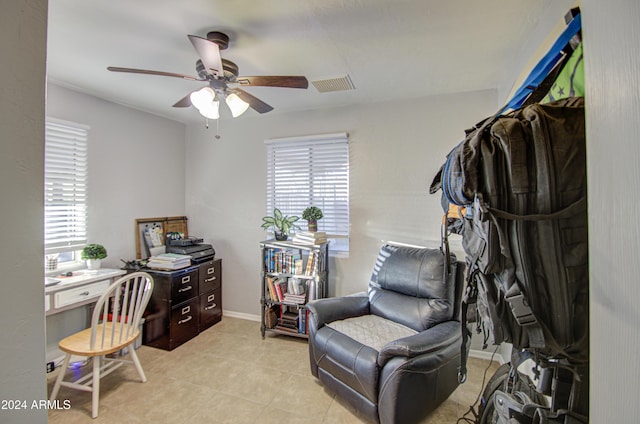 office area featuring ceiling fan and light tile patterned floors