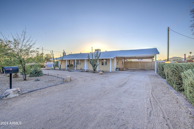 single story home featuring a carport