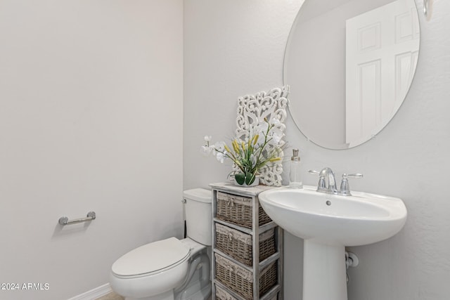 bathroom featuring sink and toilet