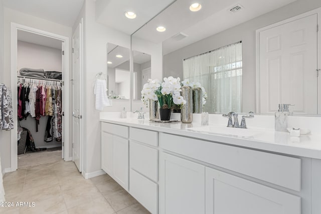 bathroom featuring vanity and tile patterned flooring