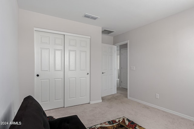 unfurnished room featuring light colored carpet