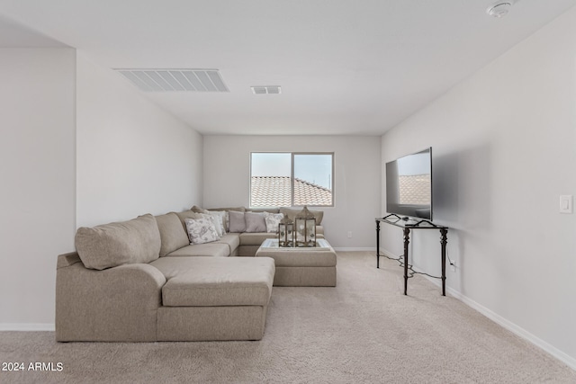 living room featuring light carpet