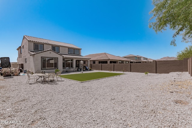 rear view of house featuring a patio area