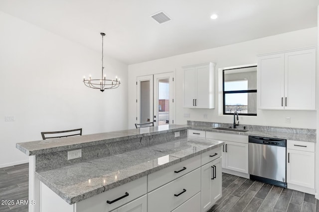 20111 W Saguaro Vista Dr, Wittmann, AZ 85361 - kitchen with stainless steel dishwasher, a sink, a healthy amount of sunlight, and visible vents