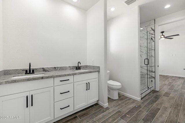 20111 W Saguaro Vista Dr, Wittmann, AZ 85361 - full bath with toilet, a marble finish shower, a sink, and wood tiled floor