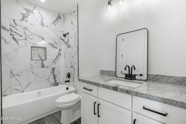 20111 W Saguaro Vista Dr, Wittmann, AZ 85361 - bathroom featuring toilet,  shower combination, wood finished floors, and vanity