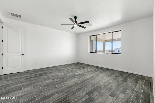 20111 W Saguaro Vista Dr, Wittmann, AZ 85361 - empty room featuring a ceiling fan, baseboards, visible vents, and dark wood-type flooring