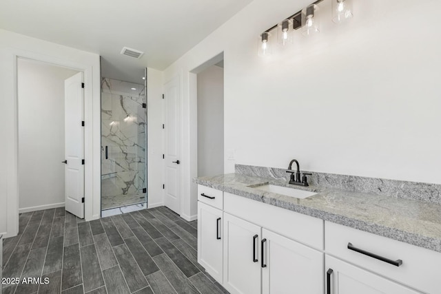 20111 W Saguaro Vista Dr, Wittmann, AZ 85361 - full bath with recessed lighting, baseboards, visible vents, and a marble finish shower
